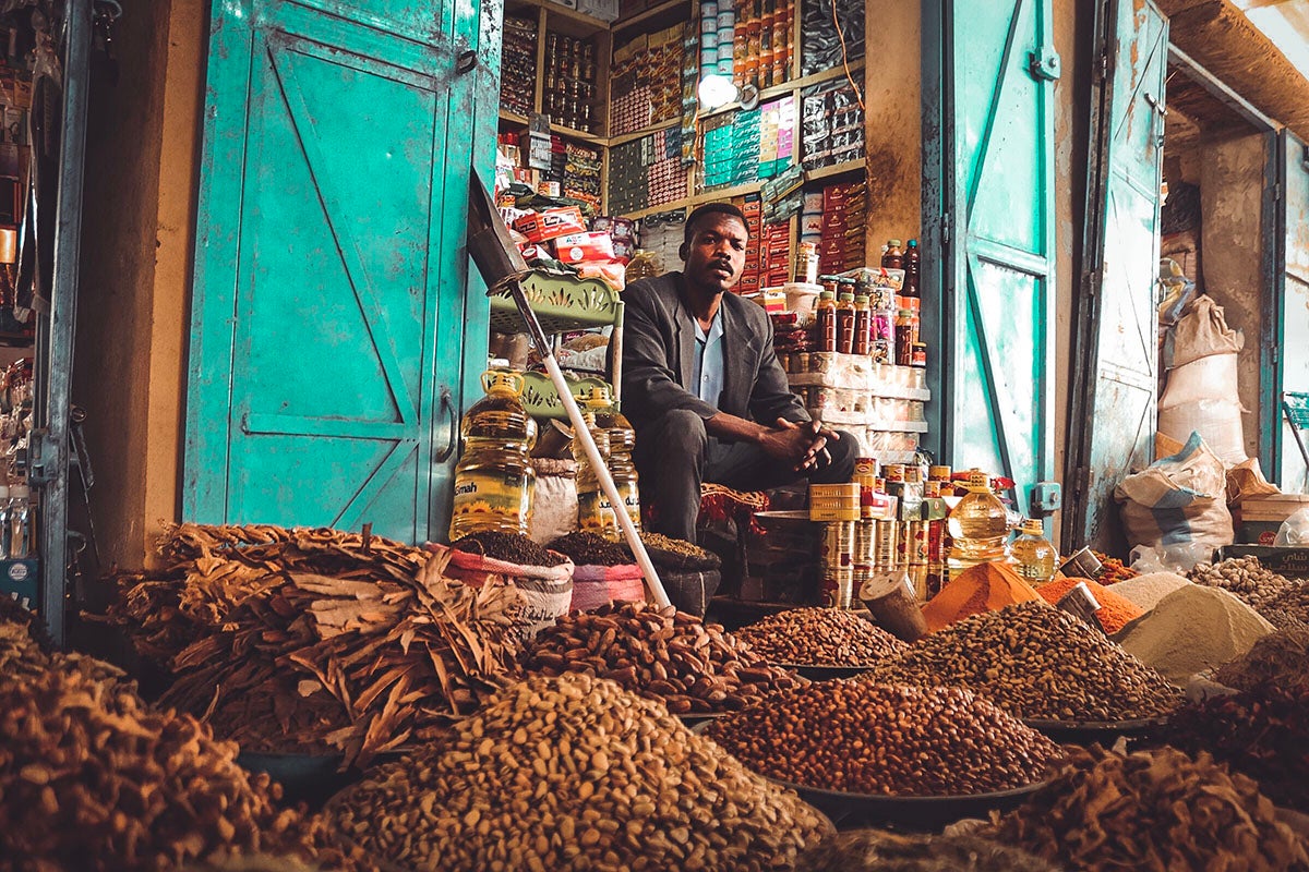 A spice and grocery merchant waits for customers in Sudan. Photo: Mohamed Faisal, 2018 CGAP Photo Contest