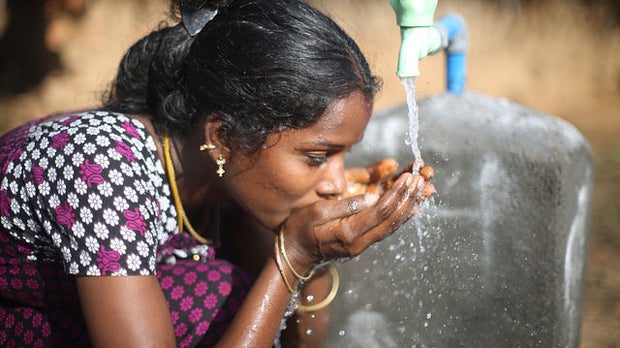 Woman drinking safe water
