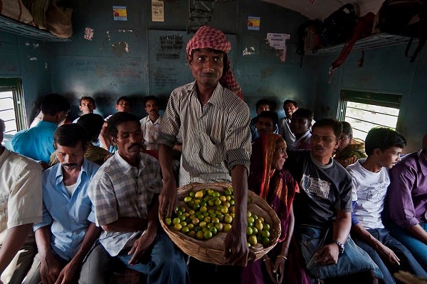 Man with lemons, India