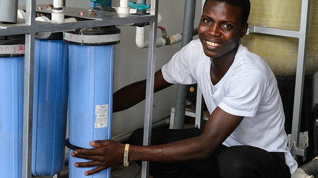 A man with Safe Water Network devices.