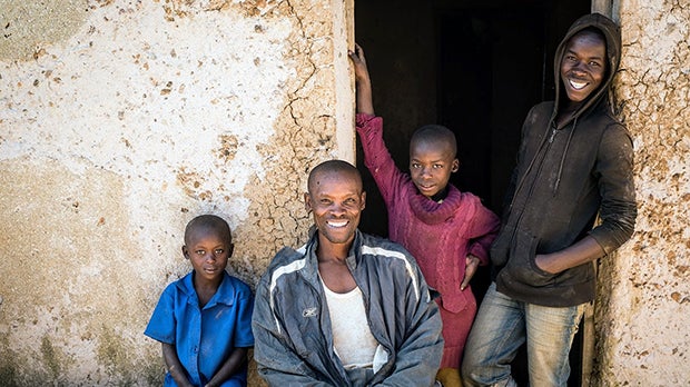 Rwandan farmer with his children