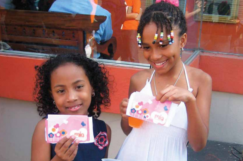 Two girls taking part in the Mia youth savings and financial education program.
