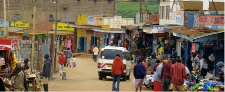 A main street lined with vendors in Kenya