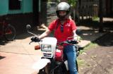 A mobile credit officer from Nicaragua prepares for her journey to the next town. Credit officers often must traverse rough, rural roads in order to reach their clients.