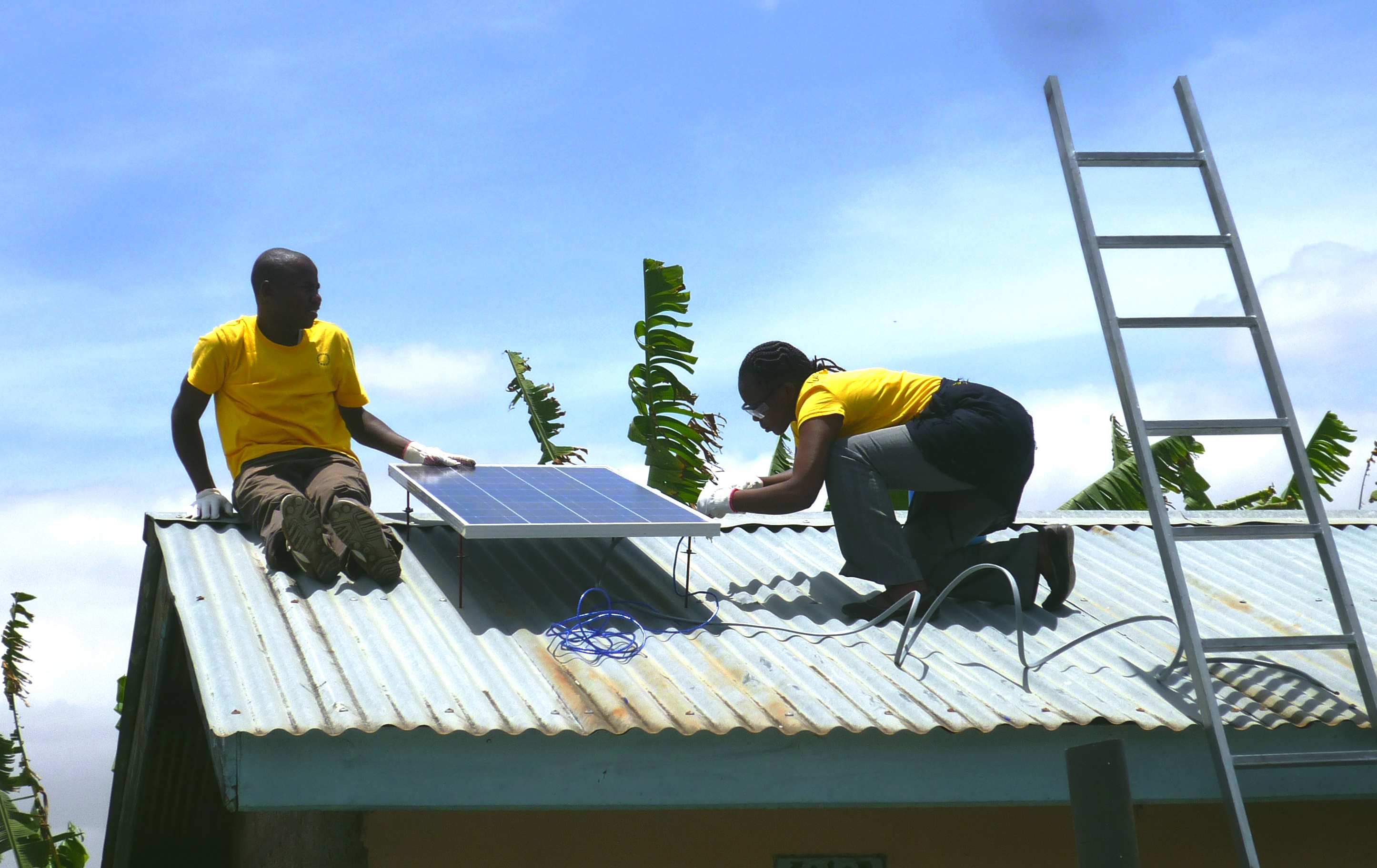 Mobisol workers on a roof in Tanzania
