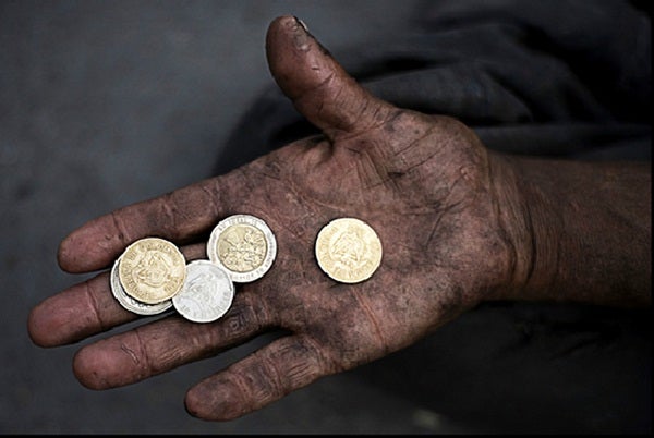 A man holds coins