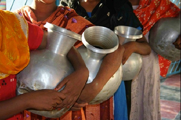Women with water containers, Bangladesh