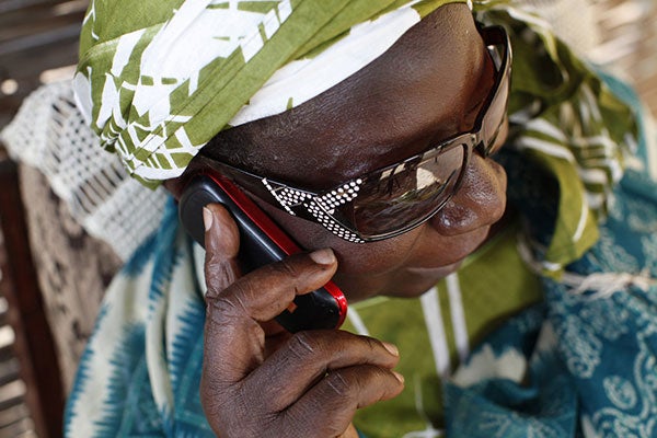 A woman uses a mobile phone.