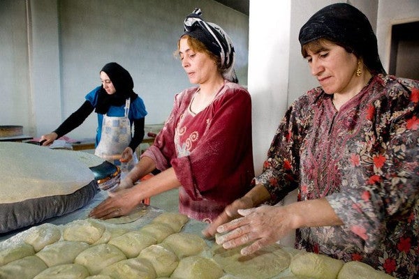 Women make bread.