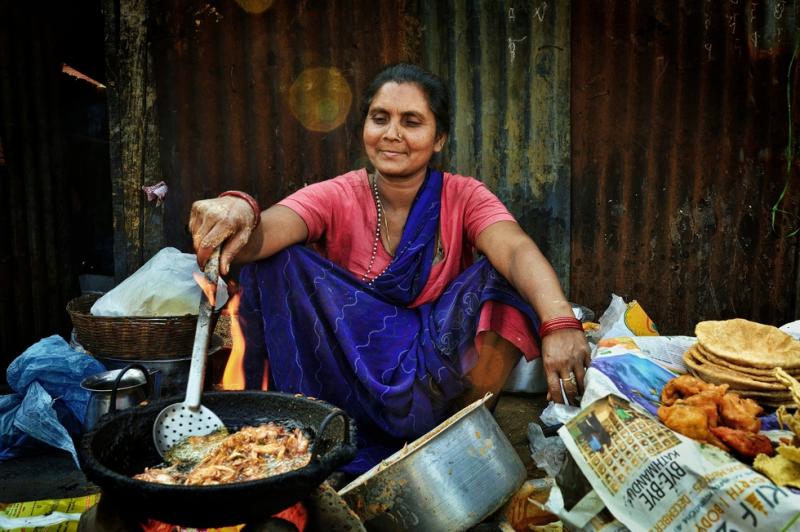 Woman frying food.