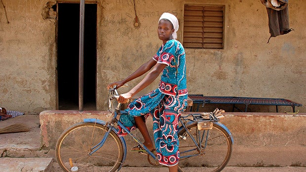 Woman on bicycle in Cote d'Ivoire