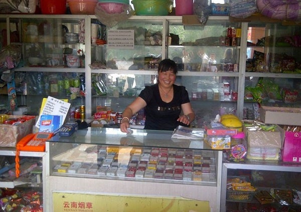 Mrs. Li Yunzhen is the owner of one shop and a small side business selling flowers.