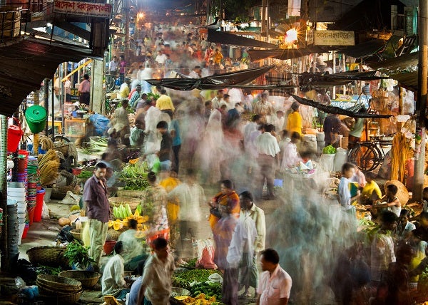 A fast-moving market at night.