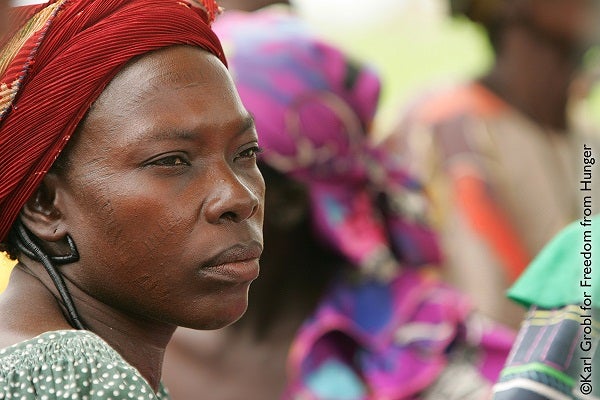 A woman in Burkina Faso looks off into the distance