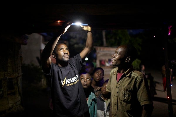 Men holding a flashlight.