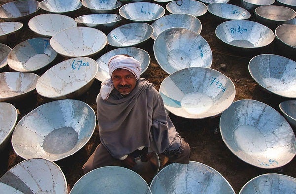A man sells steel containers
