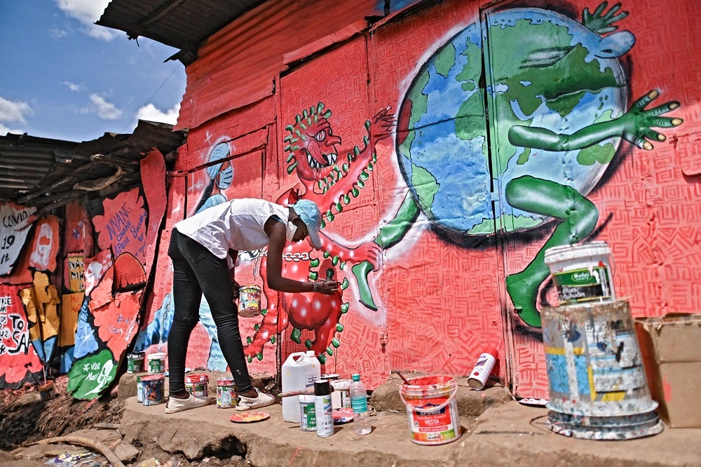 Artist paints COVID-19 mural in Nairobi, Kenya