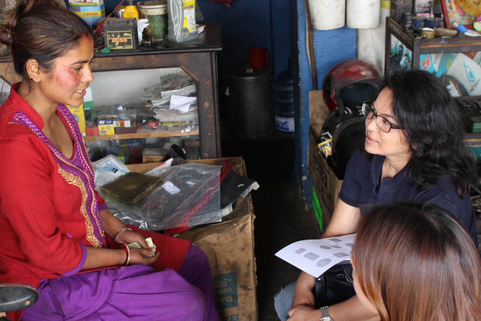 Binita talks to UNCDF about using Laxmi Bank’s doorstep collection services to put aside her savings. Photo Credit: Laxmi Bank