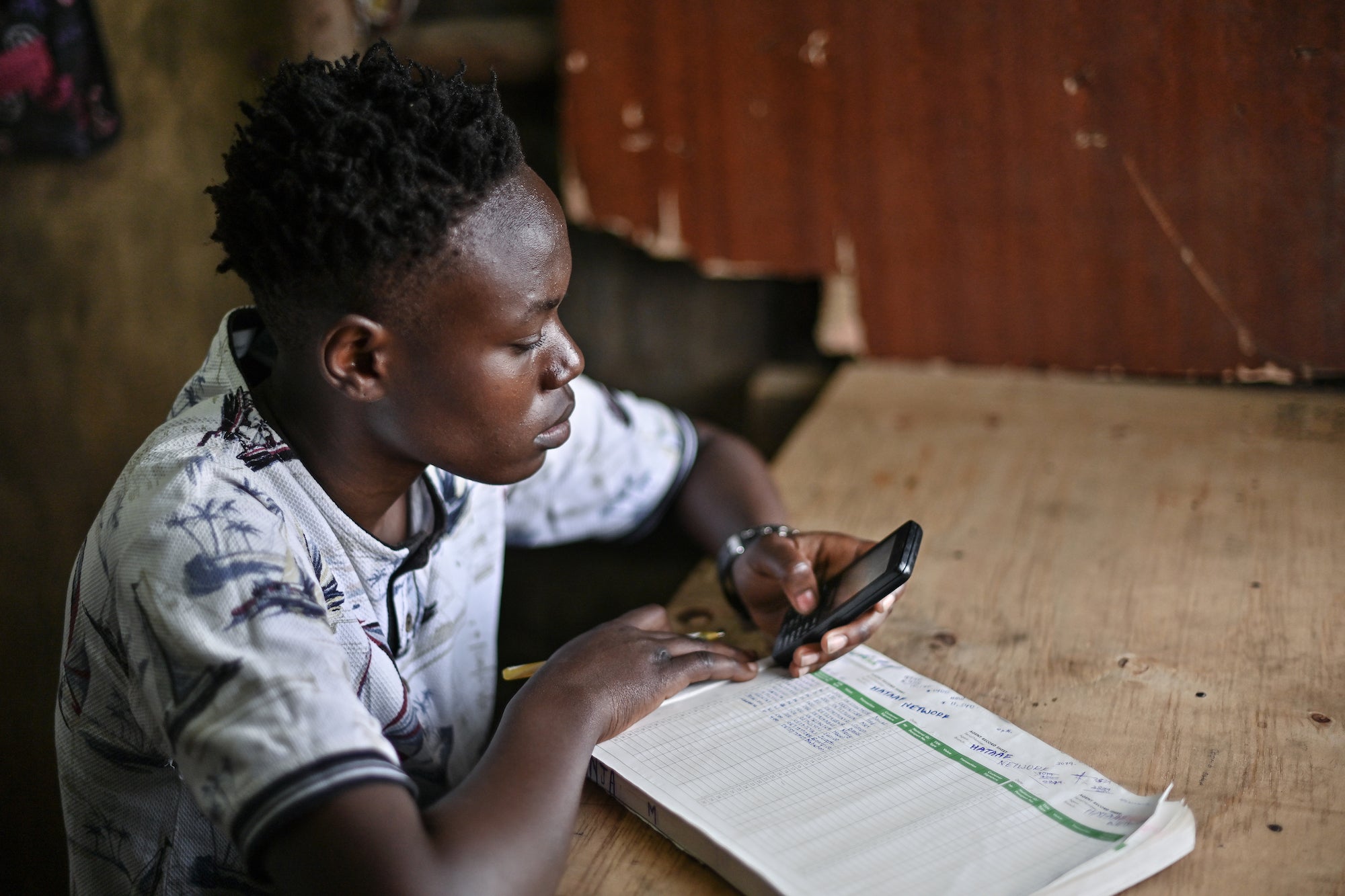A person uses mobile money. Photo by Tony Karumba via Communication for Development Ltd