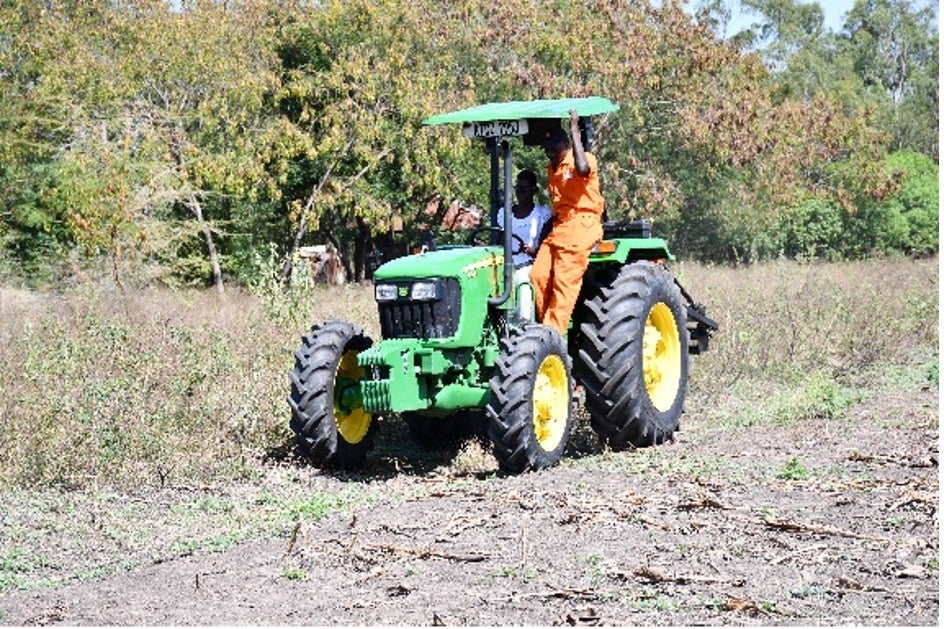 A Hello Tractor agent operates a tractor