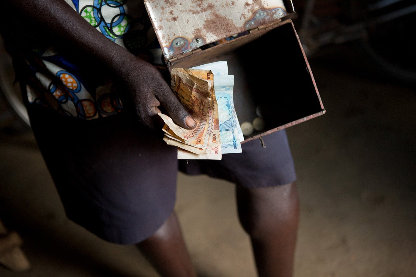 Joseph, a smallholder farmer in Uganda, doesn't have a bank account. He saves in a lock box at his house. Photo: Allison Shelley