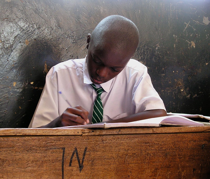 A student at his desk in Kampala, Uganda