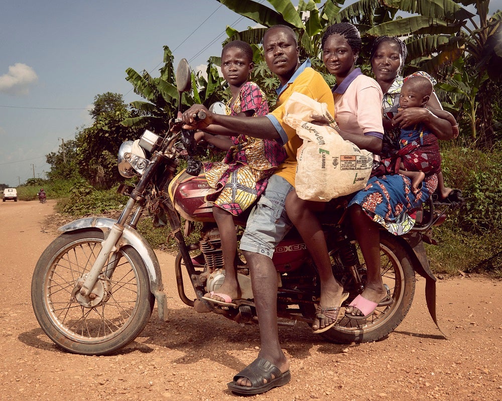 Taxi-moto driver in Benin with female passengers