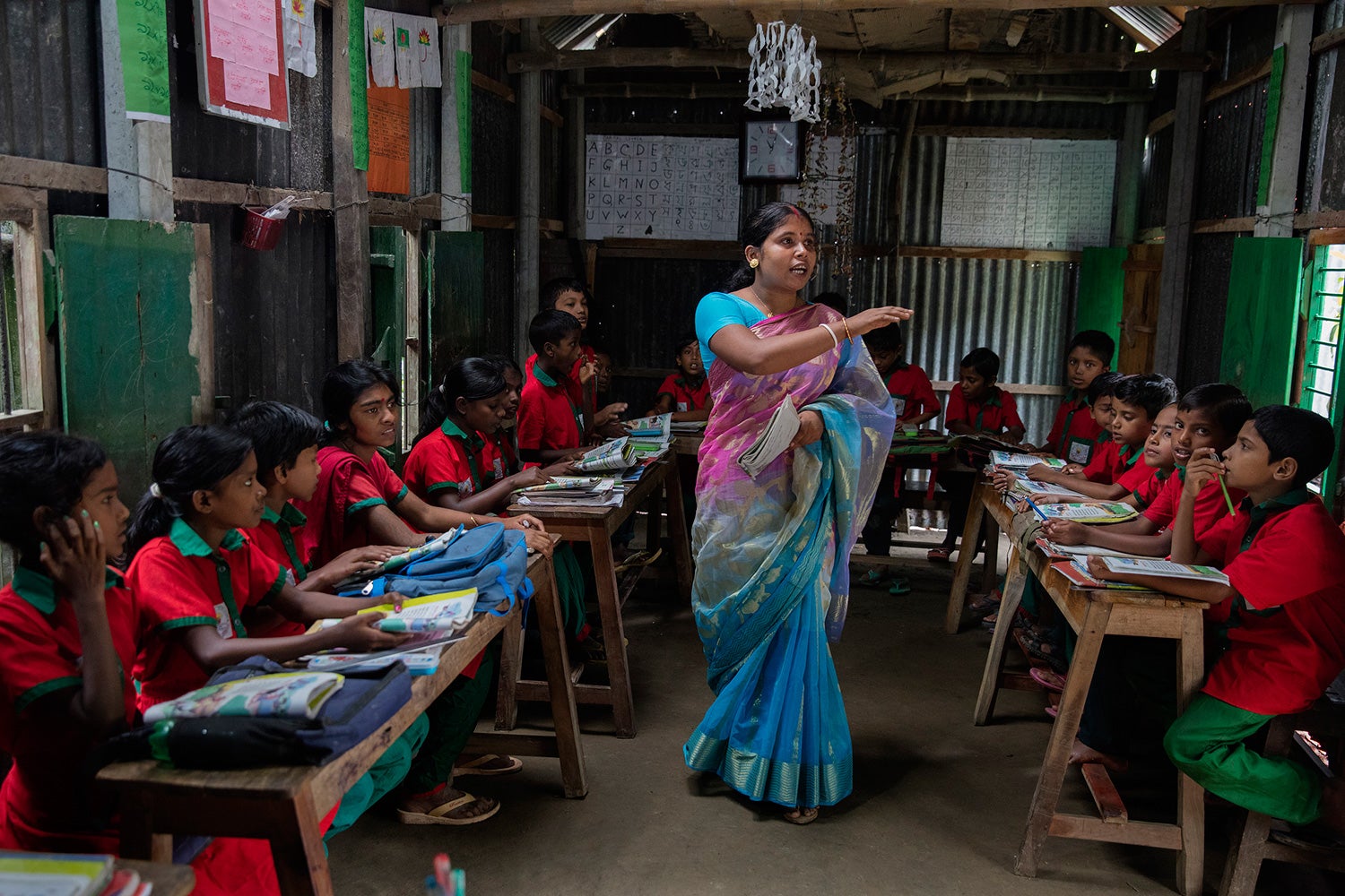 Students listen to their teacher in Sahabatpur, Bangladesh.