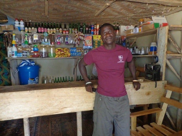 Young adults, like Prince from Liberia, often use informal or formal financial services to start or expand businesses and save money to make investments for the family. Photo: John Barbour 