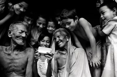 Family in India uses mobile phone