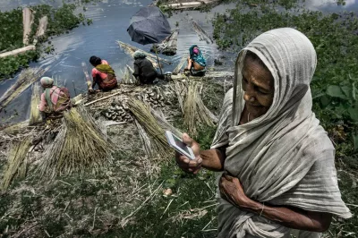 Elderly woman using her mobile phone in rural India.