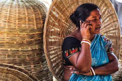 an Indian woman making an order using her mobile phone
