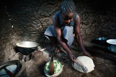 Woman cooks ugali