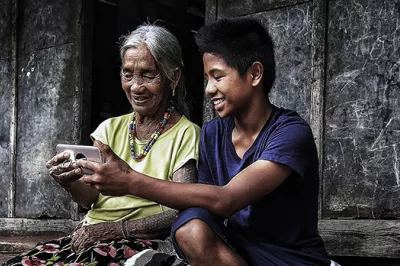 Villagers use mobile phone in Philippines