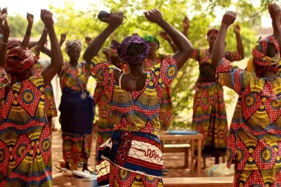 Women dancing in celebration.