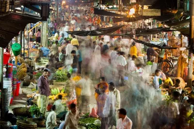 A fast-moving market at night.