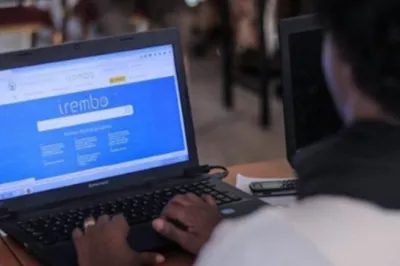 Woman accesses IREMBO on computer, Rwanda