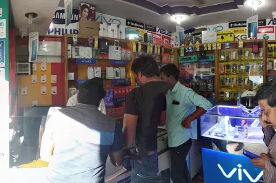 Eko customers send remittances from a small shop in India.