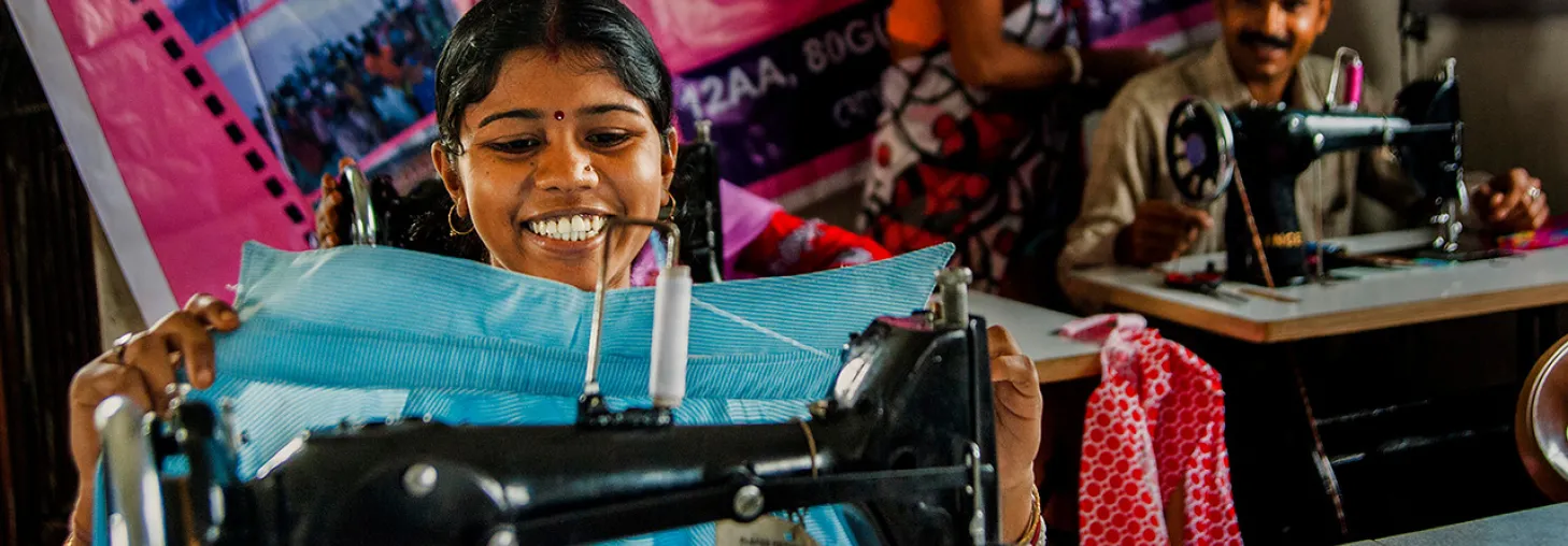 A group of people in India using sewing machines