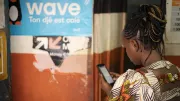 Woman uses her mobile to access digital financial services