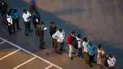 people waiting in line on the street