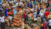 People mill about a busy market in Nigeria