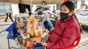 A woman vendor sells her goods