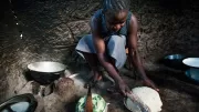 Woman cooks ugali