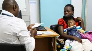 A pediatrician examines a child in a Nairobi hospital.