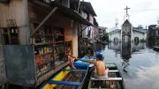 Residents in the Philippines use boats to visit shops