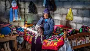 Woman holding lamb in her arms, Peru. Photo: David Martin Huamani Bedoya, 2017 CGAP Photo Contest