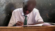 A student in primary school in Kampala