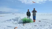 Turkish fishermen on a frozen lake