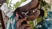 Man uses a mobile phone, Senegal. Photo by Philippe Lissac, 2011 CGAP Photo Contest.